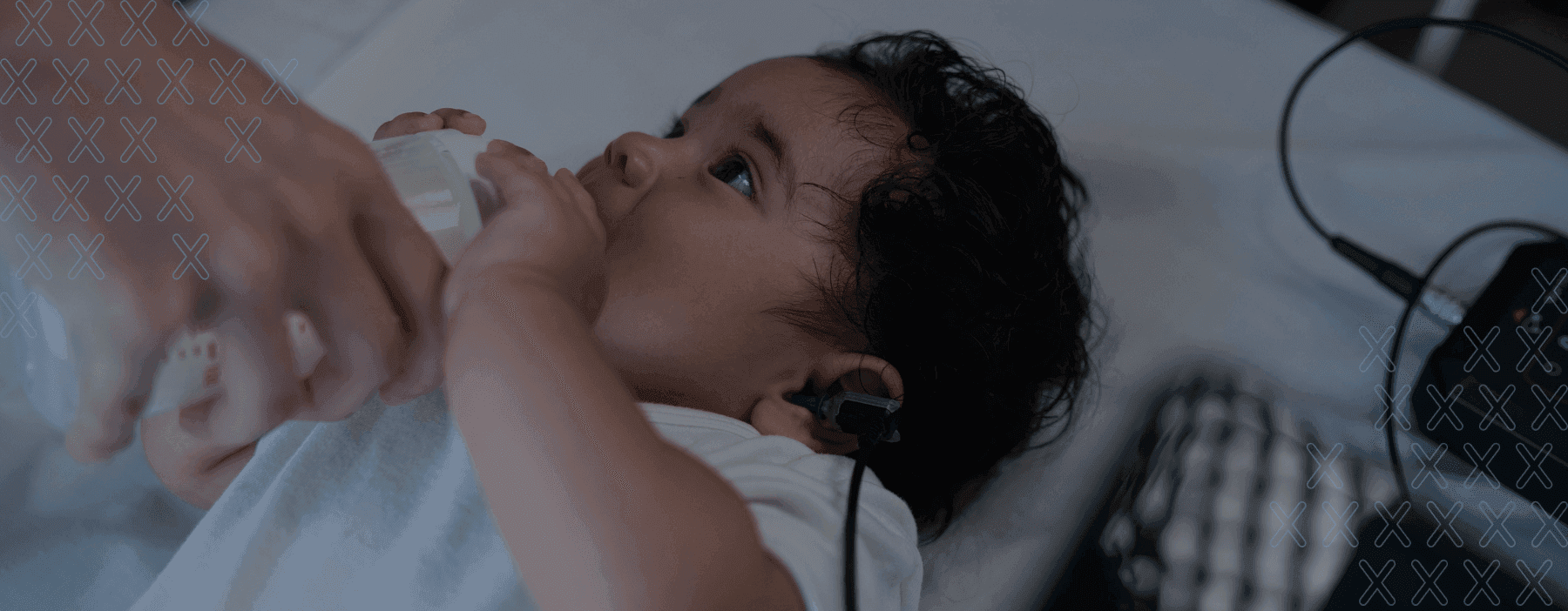 Image of a newborn undergoing an otoacoustic emissions test